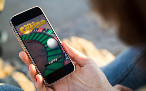 A person playing at an online casino from mobile.