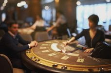 Dealer deals the cards on a casino table.